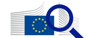 Symbolbild für Marktüberwachung in Europa: Eine Lupe ist vor der EU-Flagge